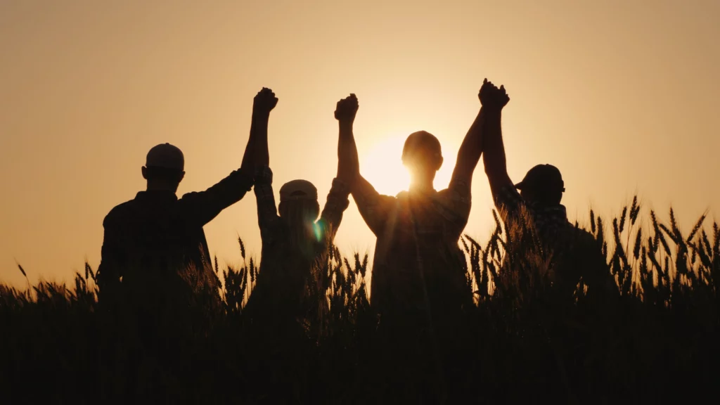 Group of people lifting hands up