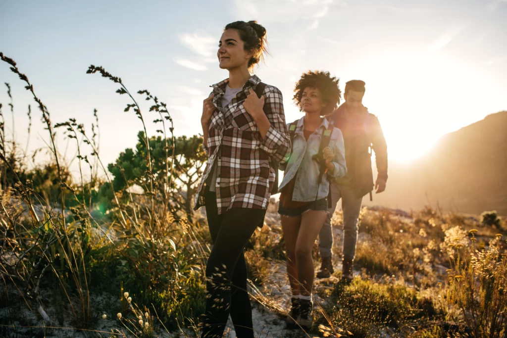 People hiking in meadow