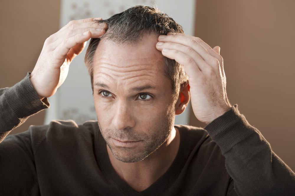 man looking at hair loss from meth use